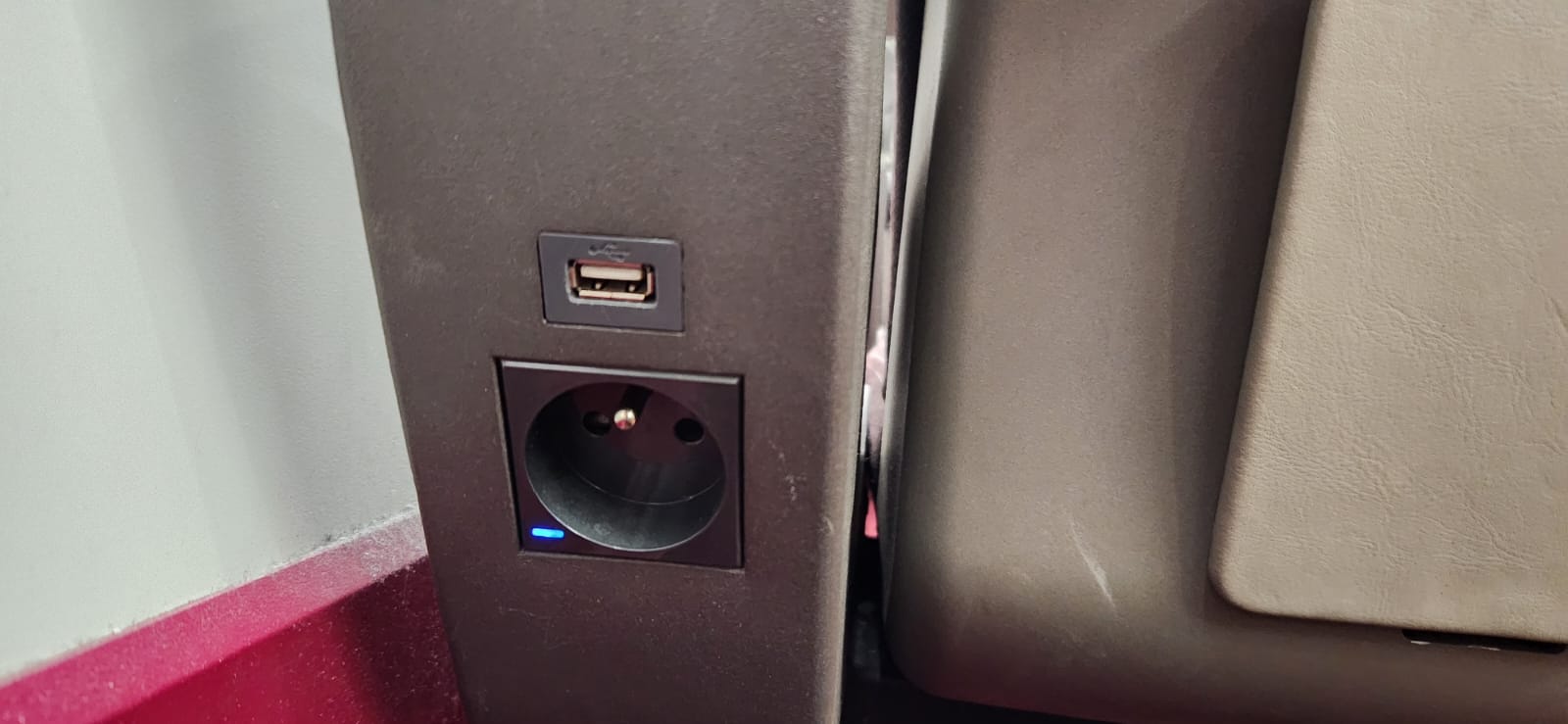 The plug socket and USB port at a seat in Eurostar Standard Premier