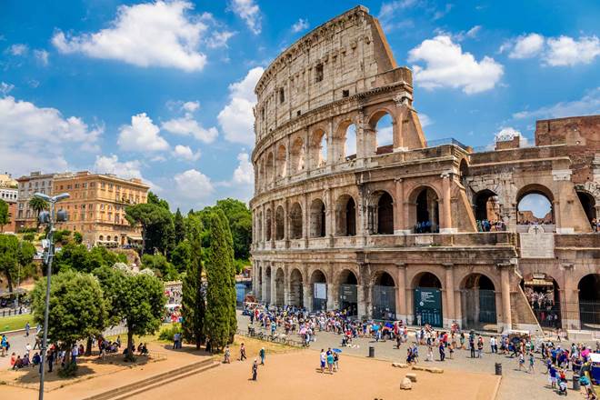 Colosseum with clear blue sky and clouds, Rome