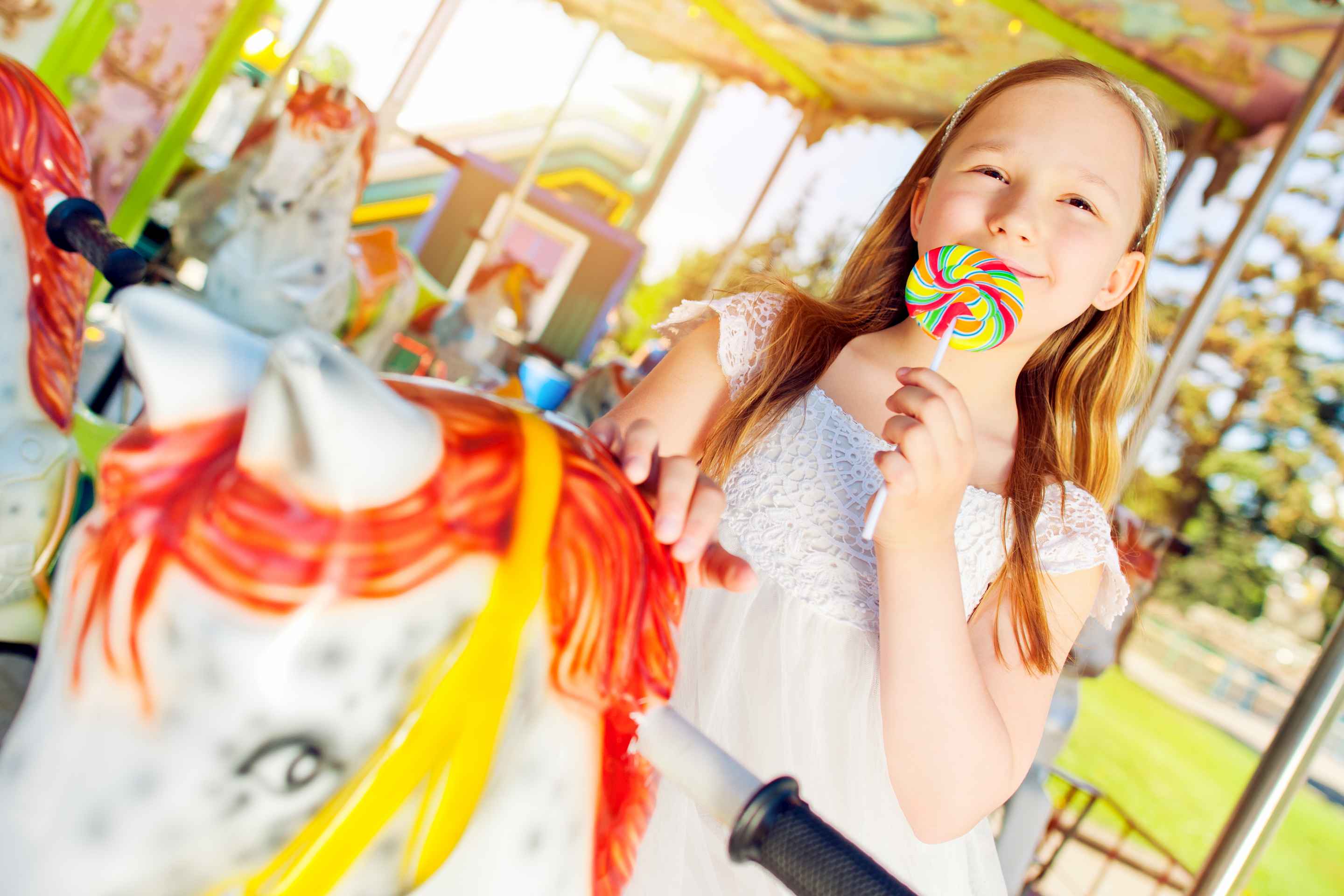 Girl on a carousel ride