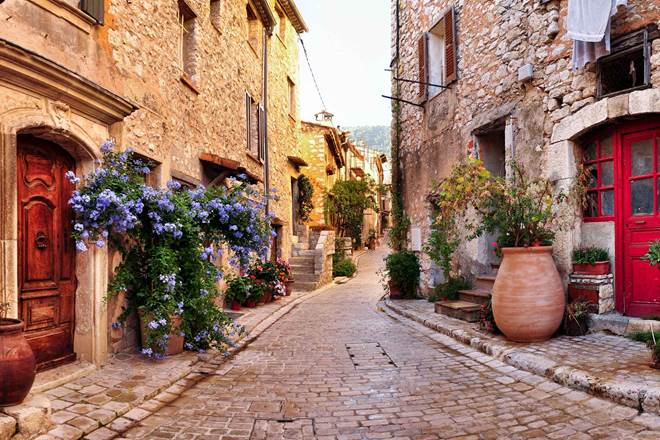 Old French village houses and cobblestone street