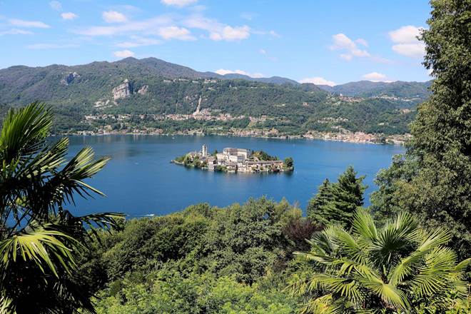Viewpoint from Sacro Monte di Orta to Lake Orta and Isola San Giulio in summer, Piedmont Italy