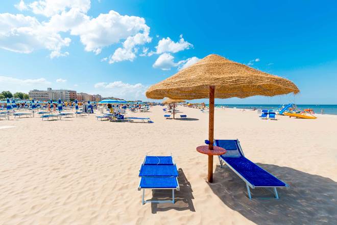 Beach with clean white sand. Rimini beach on a sunny day.