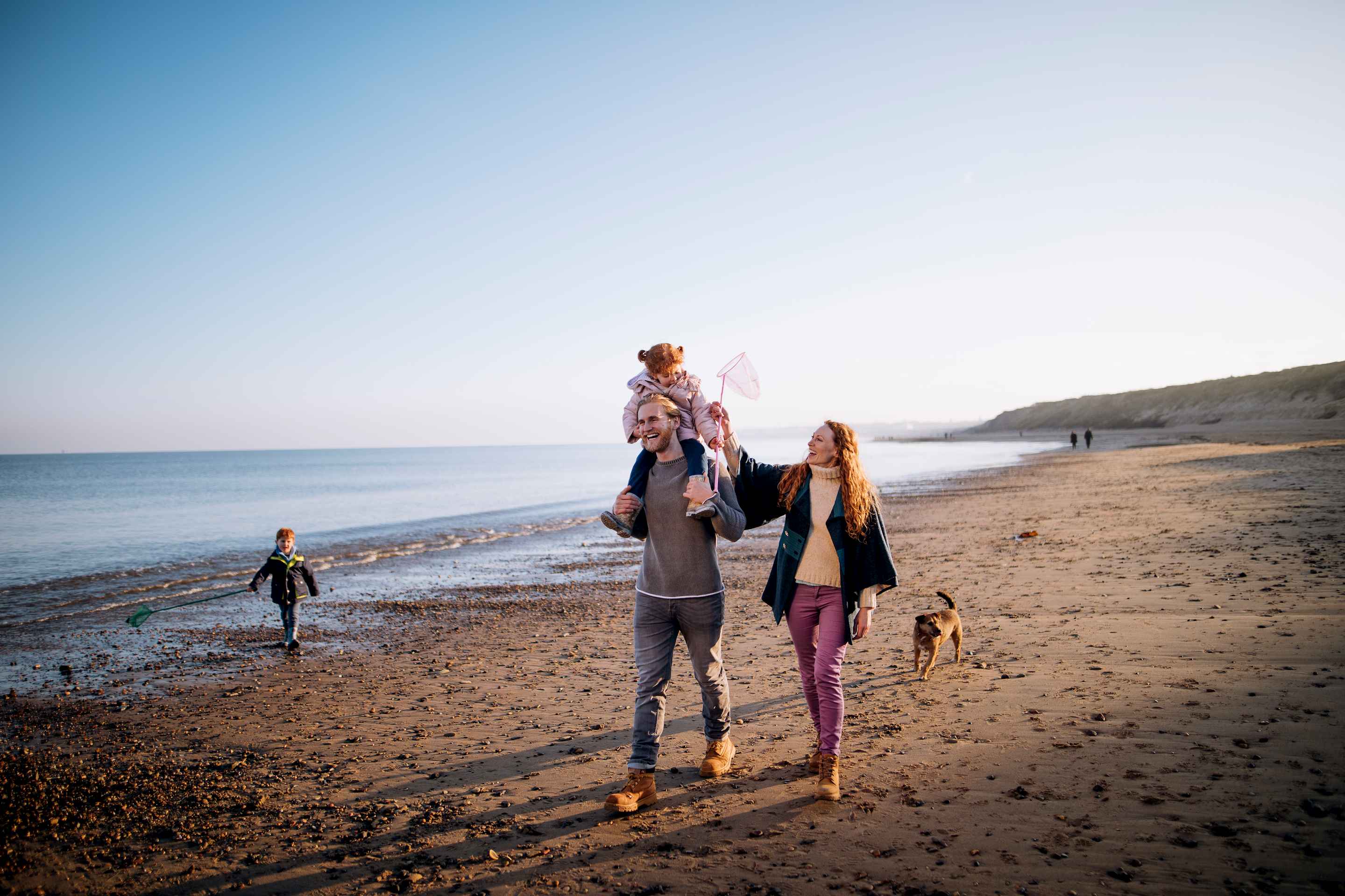 family walking on beach