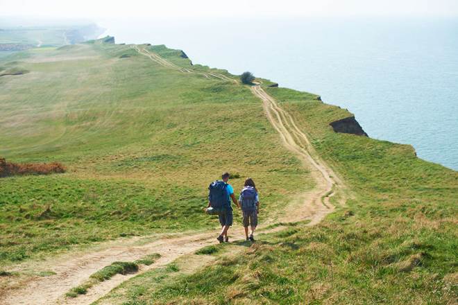 Couple hiking along a coastal path