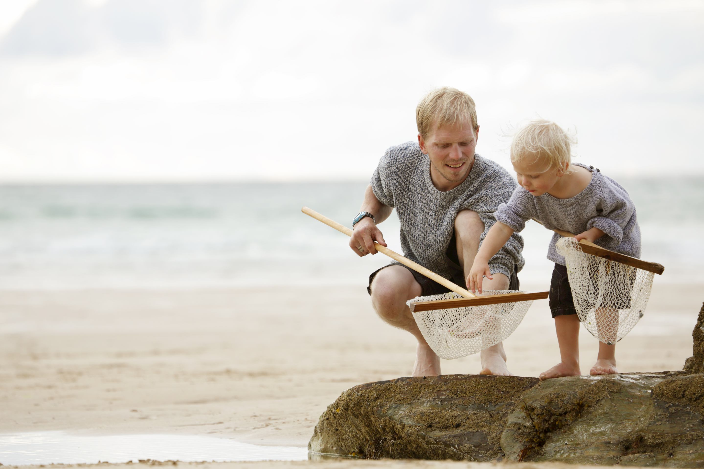 man fishing with child