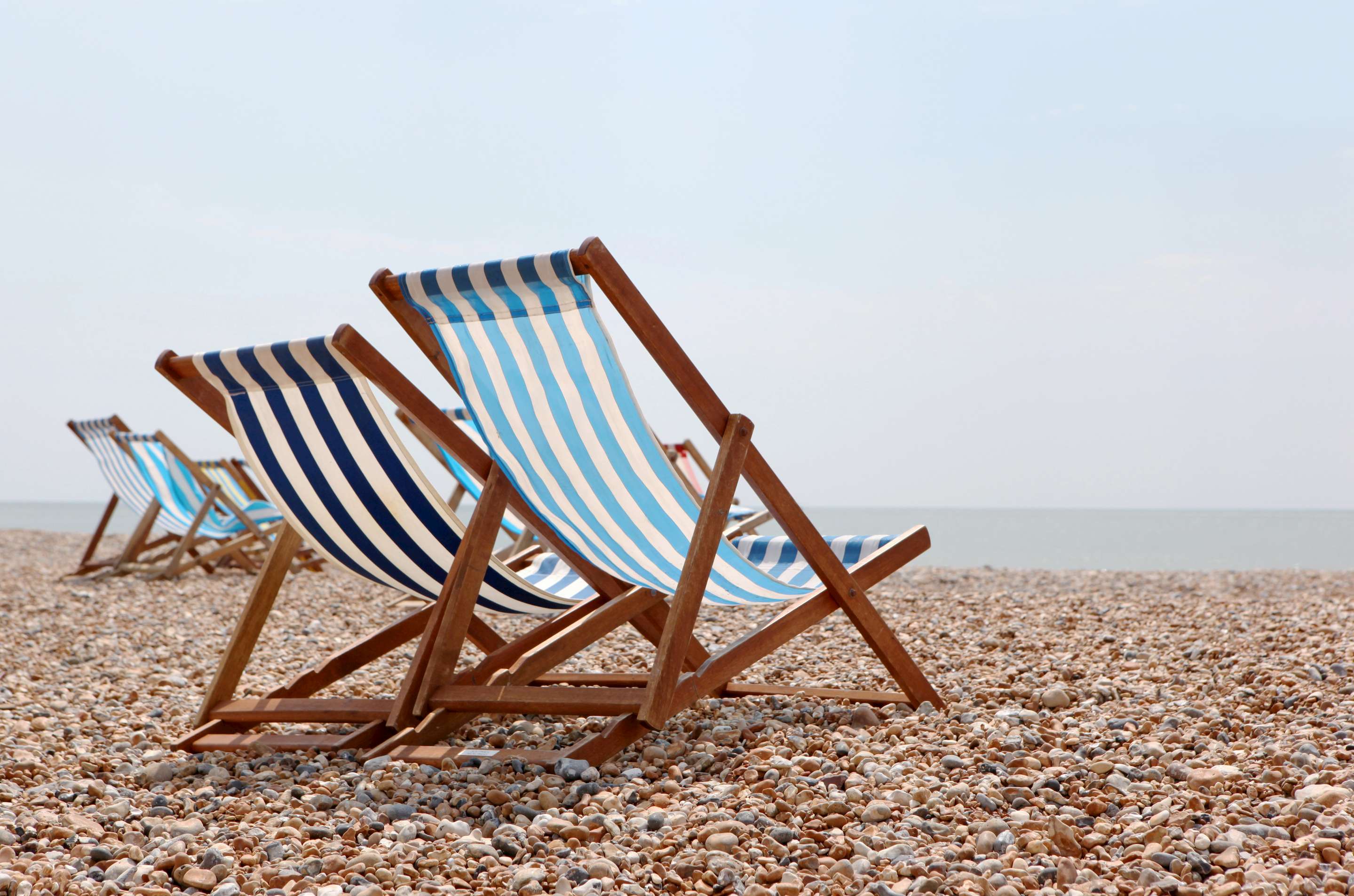 deckchairs on pebble beach