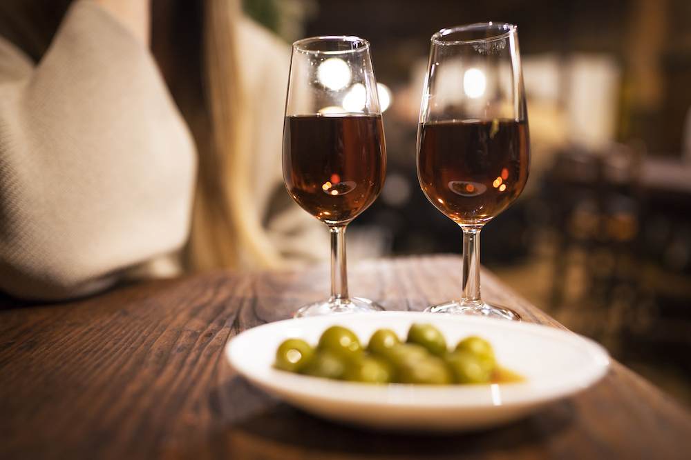 olives and two glasses of wine