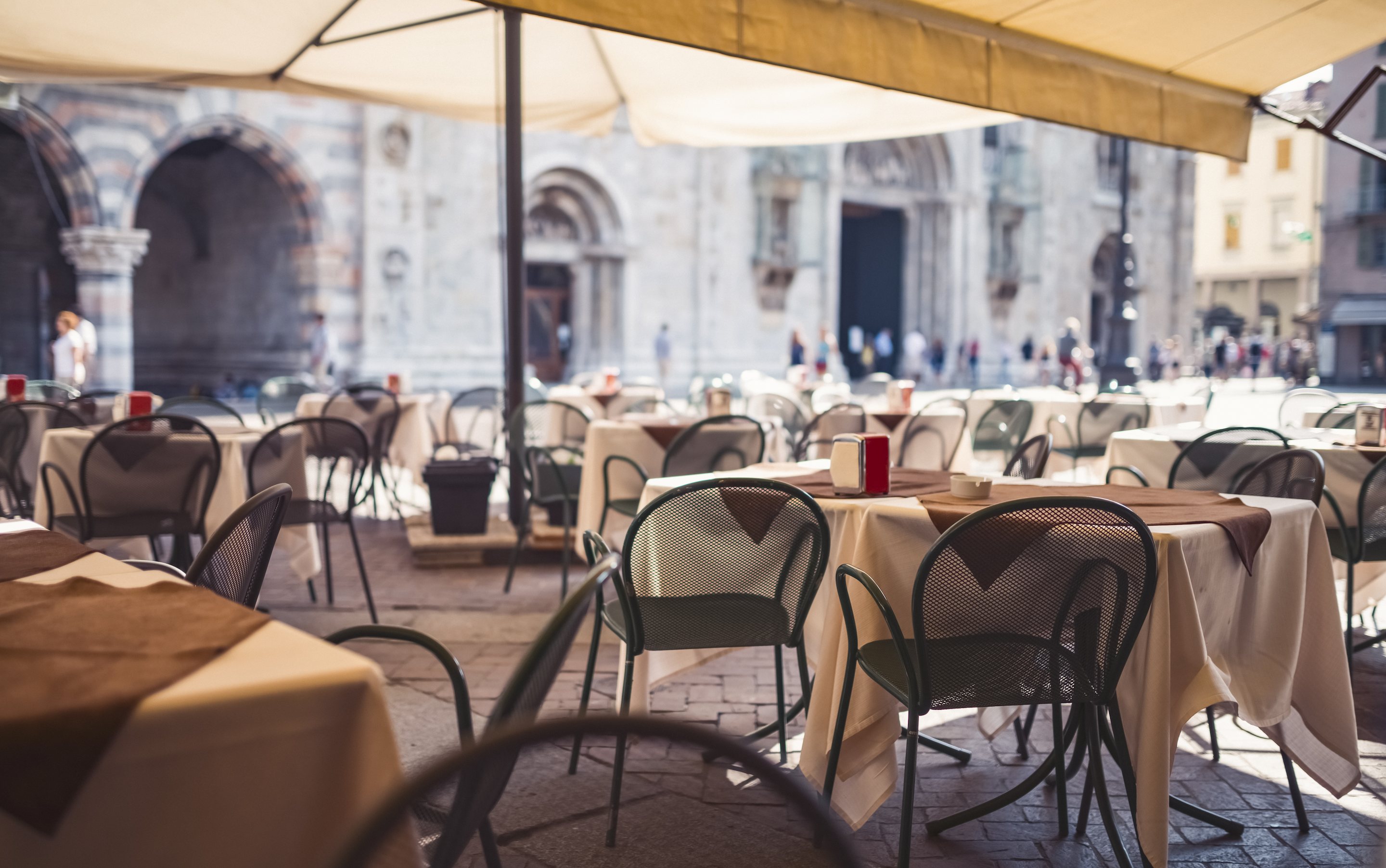 empty seats at restaurant in milan