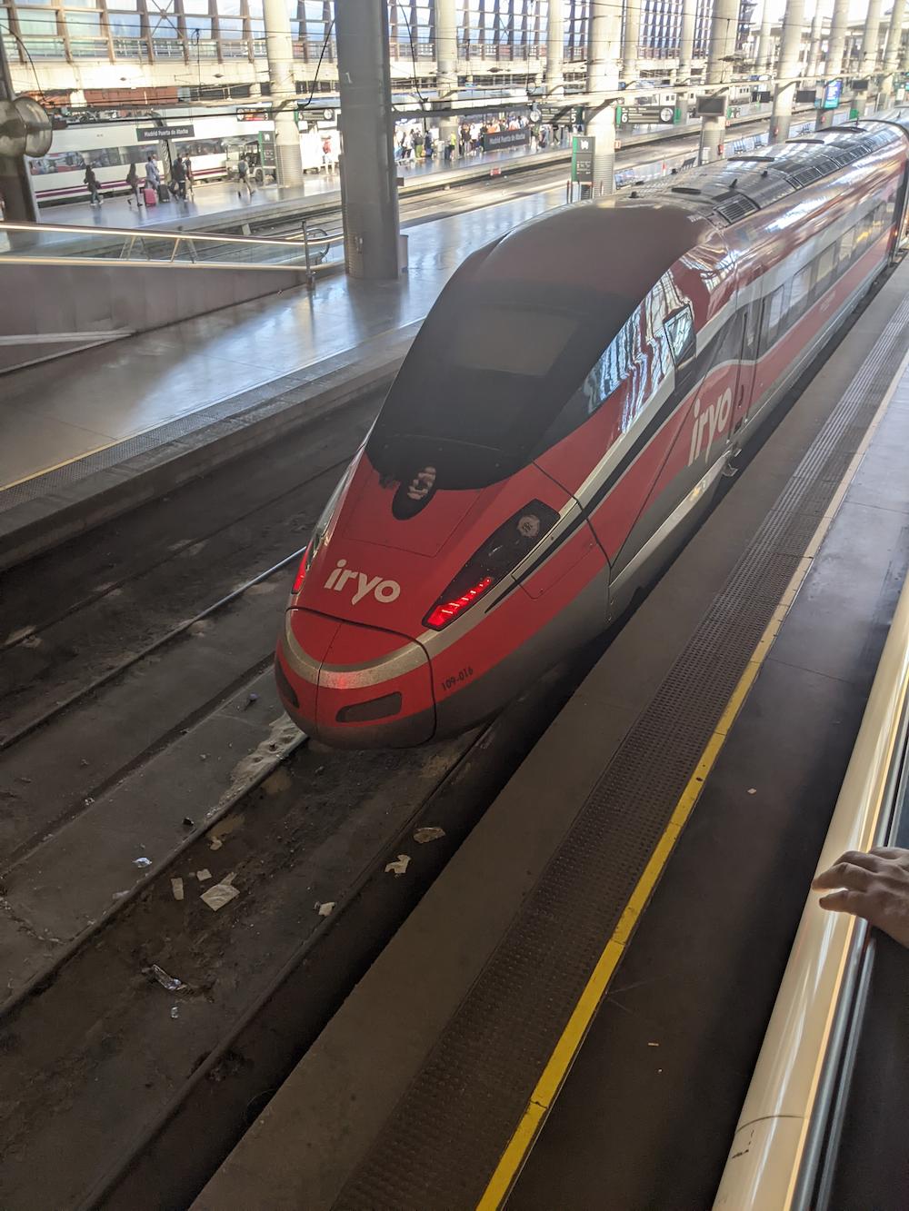 iryo train at platform in Madrid Atocha station