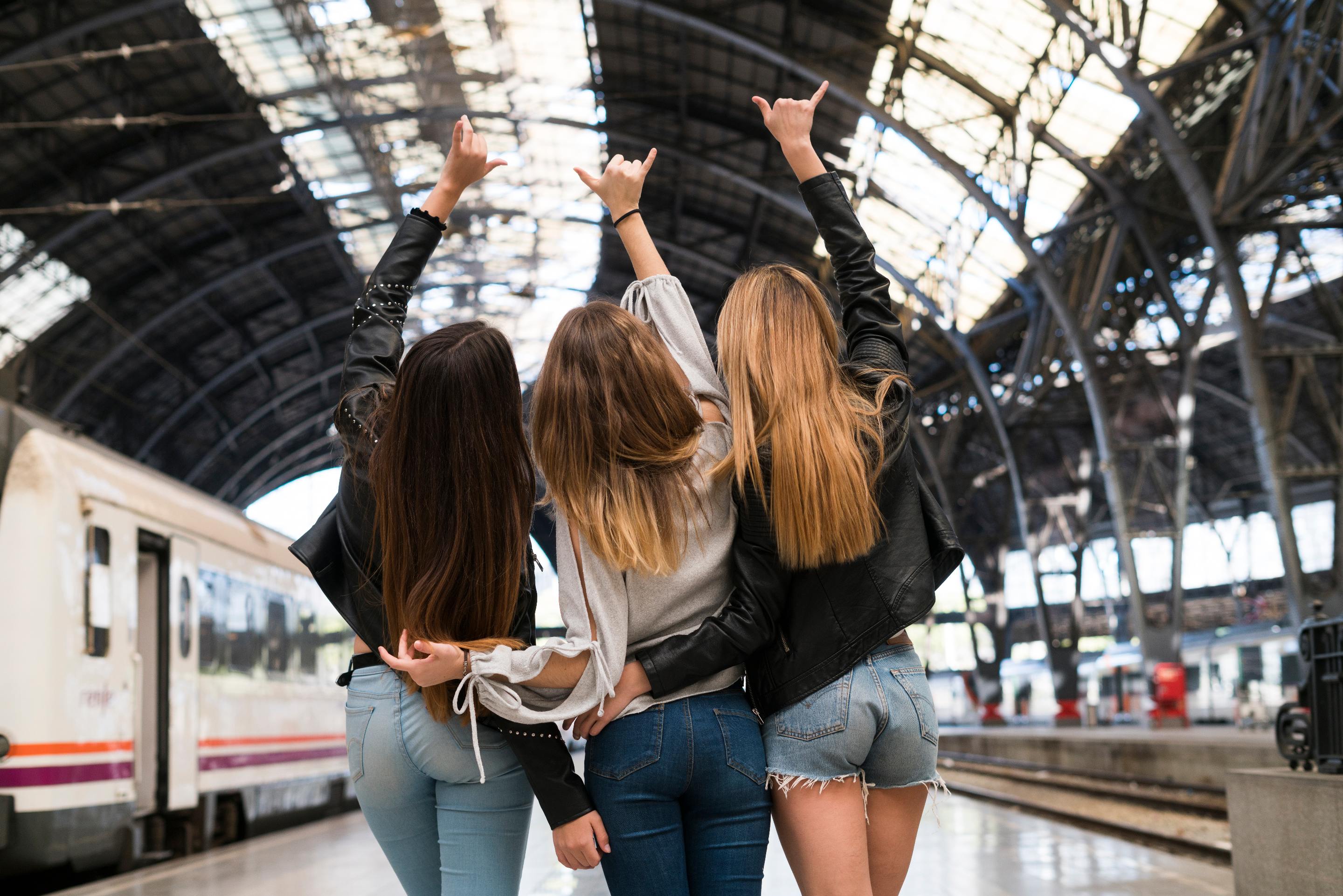 Three women on a train platform in Spain